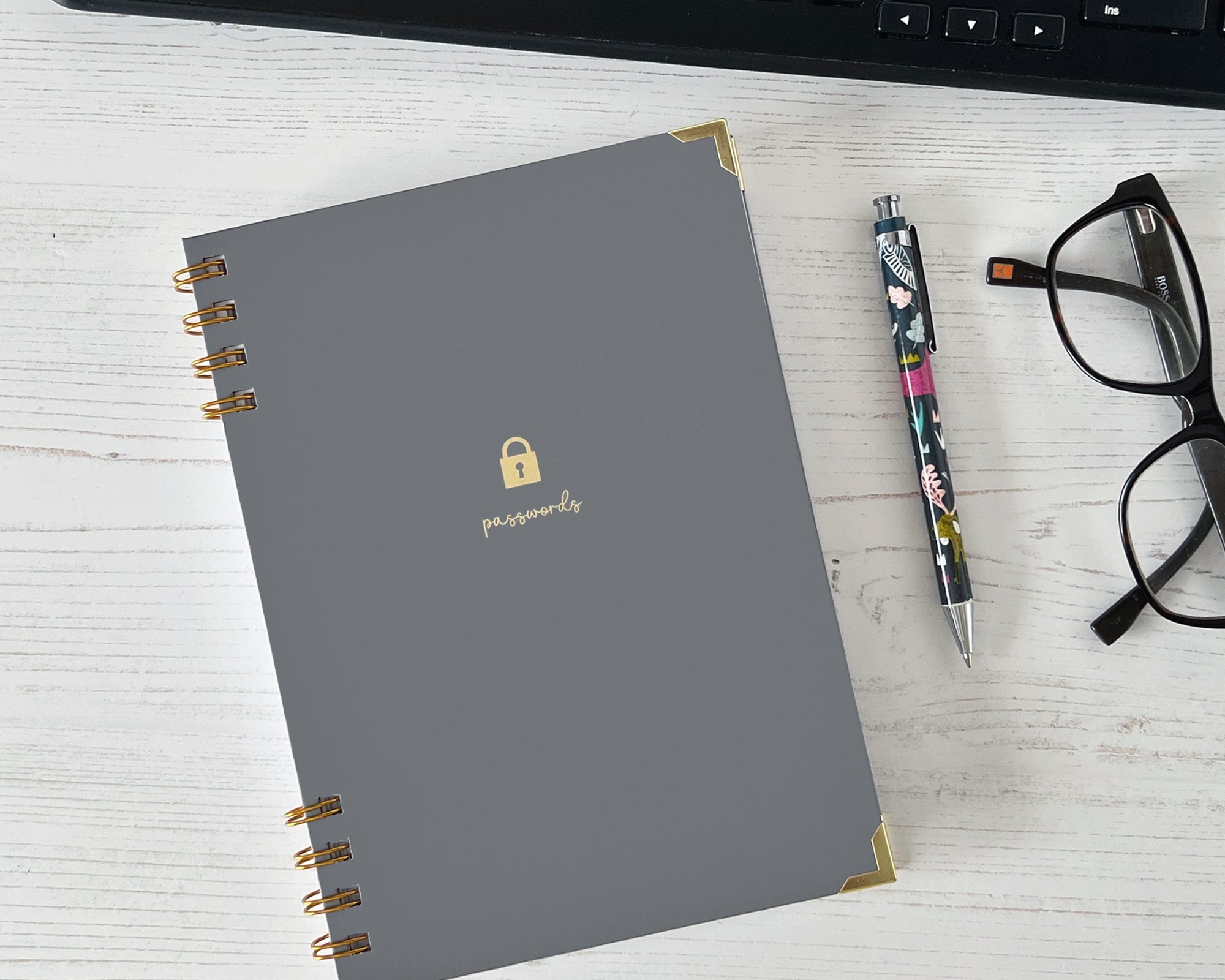 Grey password keeper notebook with gold foiled cover. 