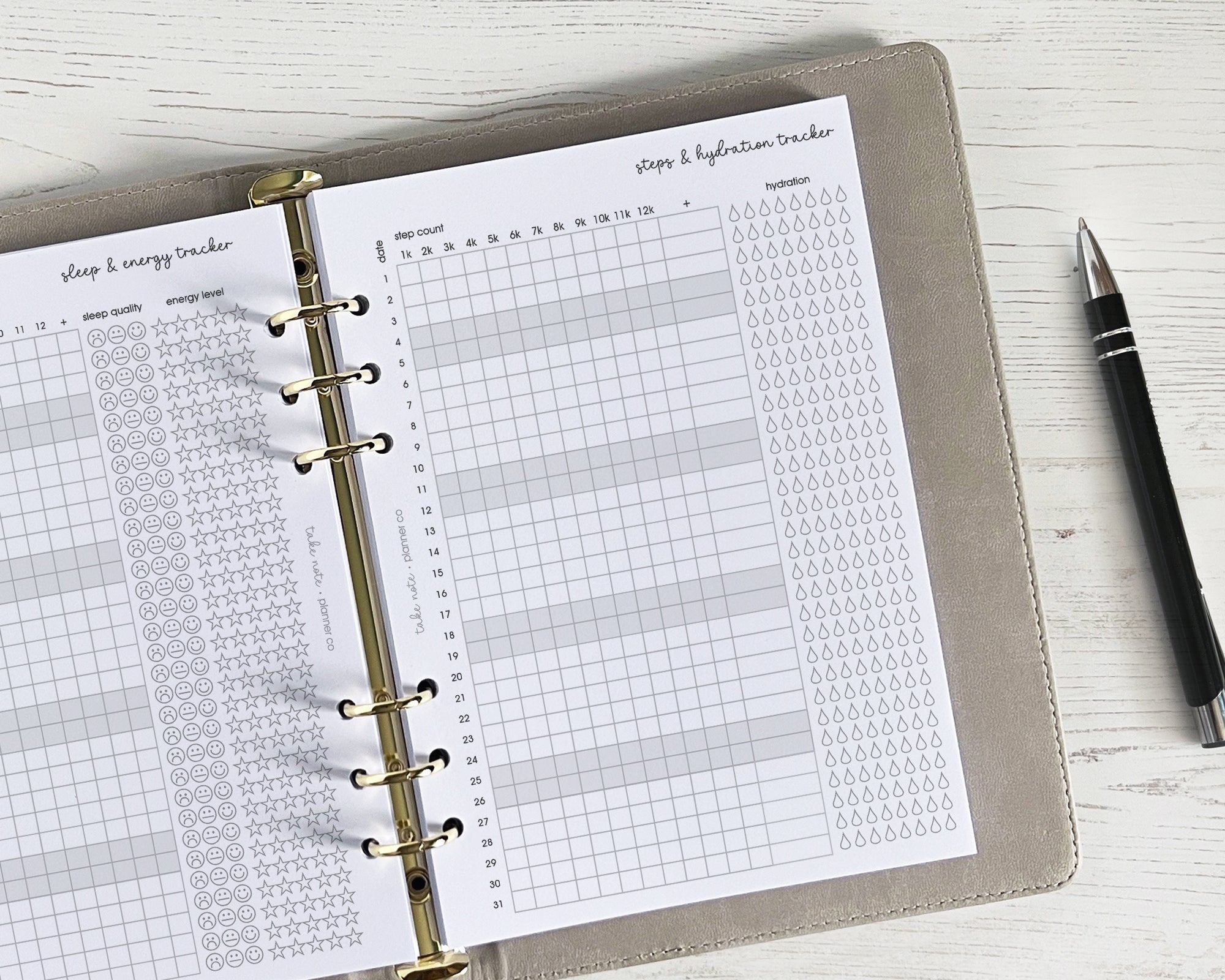 Planner with a sleep and activity tracker on a white surface