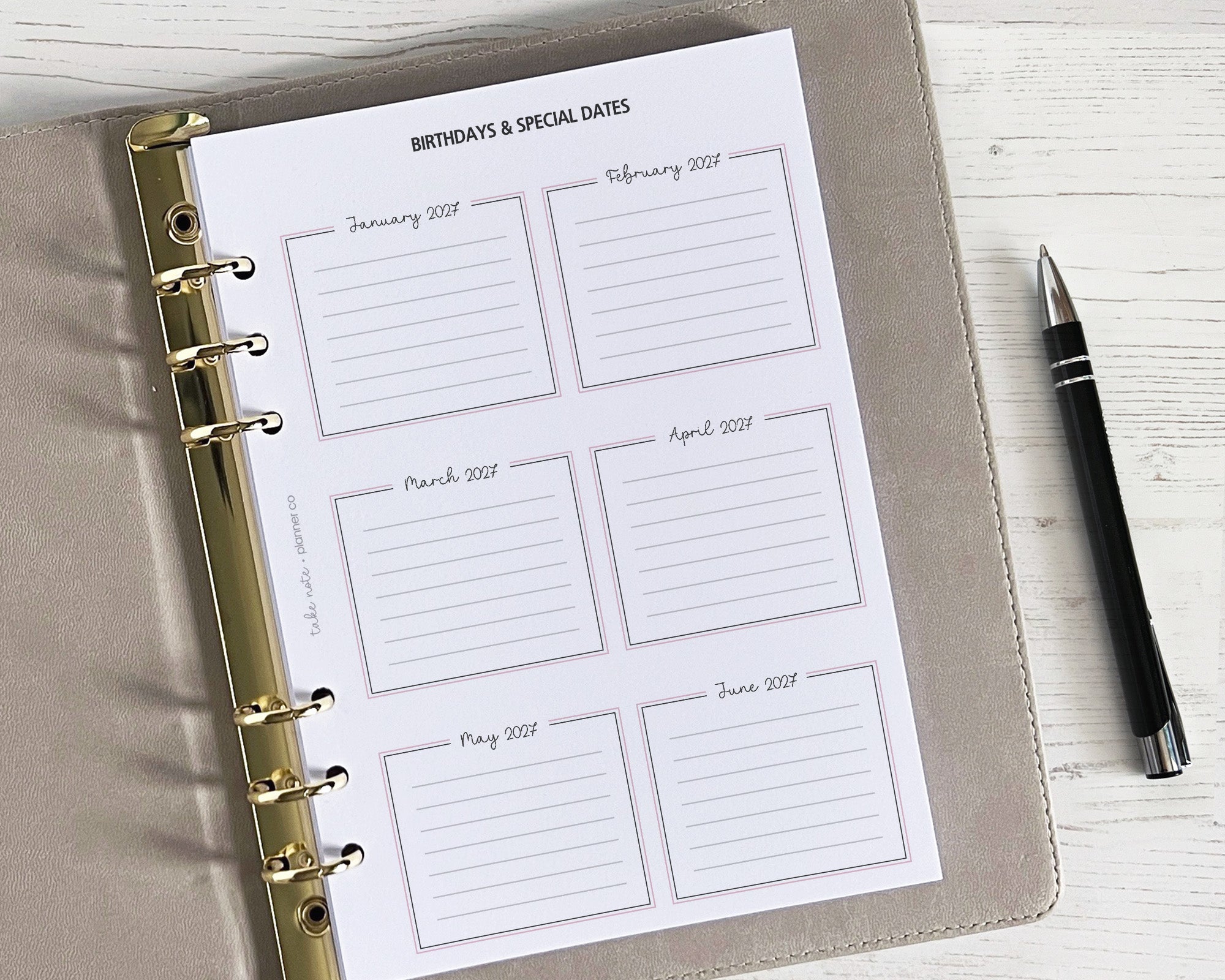 A5 sized yearly overview insert with spaces for writing in birthdays and special dates, with a classic design and a pen beside it.