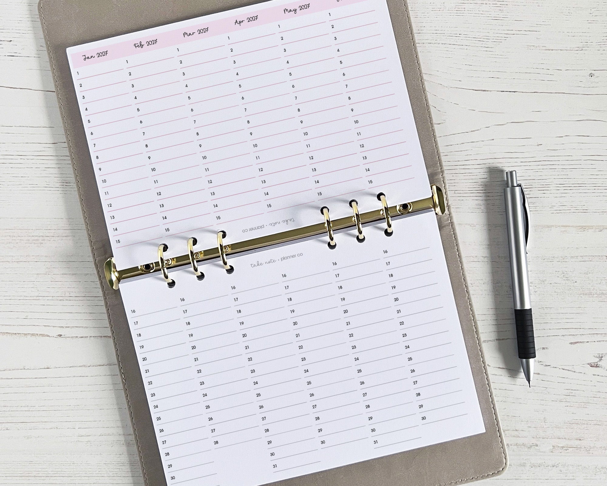 A quarterly overview insert with a yearly design, featuring a golden ring binder mechanism, A5 size, with a double-sided sheet for tracking appointments and events.